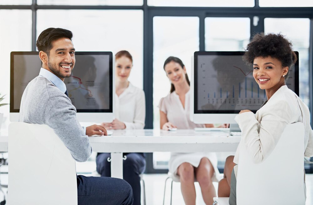 IT professionals working together in coworking office space