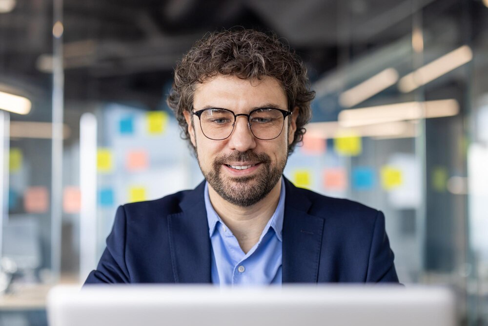 BI Developer working on dashboards in modern office